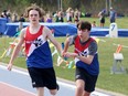 Runners from Ecole secondaire Macdonald-Cartier take part in a boys 4x400-metre event during the SDSSAA track relays at the Laurentian Community Track Complex in Sudbury, Ontario on Wednesday, May 11, 2022.