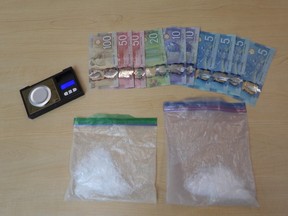 Drugs, cash and a scale are seen after being confiscated by Belleville Police after a drug trafficking investigation. Submitted.