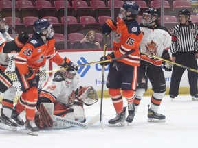 Soo Thunderbirds forward Cole Delarosbil (#25) and Dharan Cap (#15) follow the flight of the puck during Game 1 of the NOJHL league final at the GFL Memorial Gardens on May 1. Brock Santa-Maria scored the series-winning goal in OT as the Thunderbirds picked up a 3-2 win at the John Rhodes Community Centre on Thursday night.