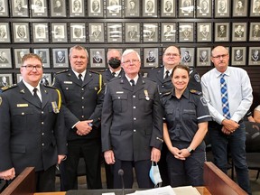 Chief Doug Socha and Hastings County Warden Rick Phillips flank this year's Exemplary Service Medal recipients of Hastings-Quinte Paramedic Services. Assembling Wednesday at county headquarters in Belleville were Deputy Chief Carl Bowker, second from left, Scott Bennett, Graham Christie, Anthony Langsford and Merilee Stewart. Paramedic Scott Monroe was not present.