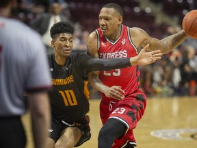 Windsor’s Billy White drives past Sudbury’s Tyrell Gumbs-Frater during a National Basketball League of Canada game between the Windsor Express and the Sudbury Five at WFCU Centre in Windsor, Ontario, on Friday, May 13, 2022. Visit www.thesudburystar.com for a story from Friday's game.