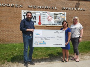 Saugeen Shores Mayor Luke Charbonneau delivered the first $50,000 installment of the Town’s $250,000 pledge to help fund a CT Scanner a Saugeen Memorial Hospital to Jenny Scongack (centre) CT Campaign Co-Chair and Stacey Catalano Saugeen Memorial Hospital Foundation board chair. [Submitted]