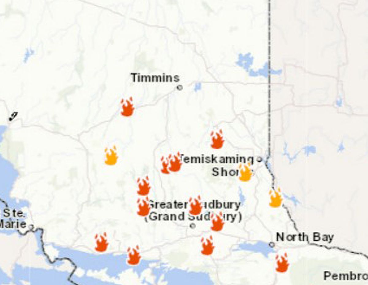 Water bombers being used to suppress fire which forced evacuation of