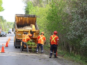 Quinte West Public Works crews clean up branch debris along a roadway in Quinte West. Submitted.