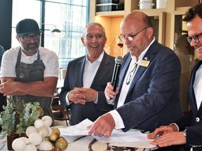 The official grand re-opening for The Royal was held Monday after a nine-year journey by Toronto’s Sorbara family owners to restore and reimagine the 142-year-old historic structure on main street Picton. From left, executive chef Albert Ponzo, owner Gregory Sorbara, Prince Edward County Mayor Steve Ferguson and, project lead and general manager Sol Korngold share a light moment during the packed gala ceremony. DEREK BALDWIN