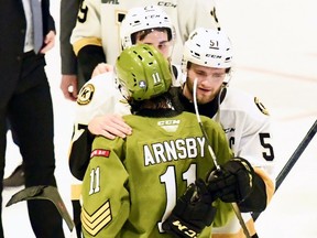 Shane Wright and Liam Arnsby share a moment after the North Bay Battalion eliminated the visiting Kingston Frontenacs from the Ontario Hockey League playoffs with a 6-5 win Saturday night. The Troops face the Hamilton Bulldogs in the Eastern Conference final.

Sean Ryan Photo