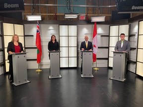 Nipissing Liberal candidate Tanya Vrebosch, NDP candidate Erika Lougheed, Progressive Conservative candidate Vic Fedeli and Green candidate Sean McClocklin pose for a picture before the start of the YourTV North Bay debate Monday evening. Candidates answered questions about the Ring of Fire, homelessness and addiction, conditions of Northern highways, Ontario Northland, mental health and long-term care, the environment and climate change.