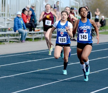 Keenyah Murray, of Timmins High & Vocational School, beats teammate Mackenzie Innes to the finish line during one of the heats in the Female 200 Metres at the Timmins High & Vocational School Track & Field Invitational Meet on Wednesday. Murray duplicated the feat in the final, edging Innes to win the event in a time of 28.04. THOMAS PERRY/THE DAILY PRESS