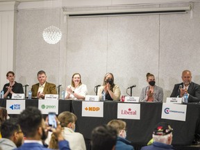 (From left): Noah Wales, Rob Collins, Erica Charlton, Alison Kelly, Emilie Leneveu and Todd Smith get ready to begin the Quinte West all-candidates night at Heroes Landing in Trenton, Ontario on Wednesday evening. ALEX FILIPE