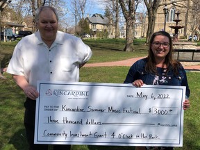Doug Kennedy, representing the Municipality, presents a cheque for $3,000 to Claire Andrusiak, representing the Kincardine Summer Music Festival, which was one of 29 local non-profit organizations that received funding from the Municipality.