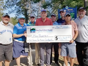 Taking part in the presentation of the grand prize in the Deep River and District Hospital Foundation’s Catch the Ace round six was, from left, Brock Sanderson, Chris Knight, Martin Chisholm, Mike Paquette, Bob Drouin, Jason Hogue, John Lee, and Tom Chapman. Paquette and his friends won $40,243 after catching the ace in week 41.