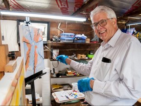 Local artist Richard Beaty, interim president of Stratford Art in the Park, works on a painting inside his home studio. The group’s 52nd season, delayed for two years due to the pandemic, begins Saturday. (Chris Montanini/Stratford Beacon Herald)