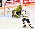 Goaltender Joe Vrbetic of the host North Bay Battalion makes a save against Ben Roger of the Kingston Frontenacs in Ontario Hockey League playoff action last Saturday. The visiting Troops open the Eastern Conference final series Friday night against the Hamilton Bulldogs.
Sean Ryan Photo