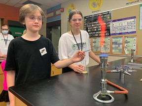 11-year-old Jack Brandon enjoyed the various stations at the STEAM (Science, Technology, Engineering, Arts and Mathematics) event at West Ferris Intermediate and Secondary School Wednesday evening. The Grade 6 student was shown how to work the flame test lab by Grade 9 STEAM student Jaelan Henstridge. West Ferris was awarded the designation of an Apple Distinguished School until 2024. The high school first received this distinction in 2015.