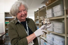 Janette Veal, a volunteer for the Stratford General Hospital Archives, shows off a silver sugar bowl presented to the Stratford General Hospital on its opening in May 1891. It was a gift of Mrs.  WE Jones and Mr. William Jones, a jeweler on Market Street.  (Chris Montanini/Stratford Beacon Herald)