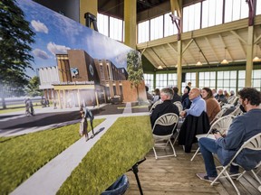 An artists rendition of the new Prince Edward County Memorial Hospital is seen as Guests talk amongst each other inside the Crystal Palace in Picton, Ontario as they celebrate the Prince Edward County Memorial Hospital Back the Build campaign reaching a milestone fundraising goal Thursday evening. ALEX FILIPE