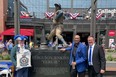 Hall of Fame pitcher and Chicago Cubs legend Fergie Jenkins, a Chatham native, had his statue unveiled outside Wrigley Field on Friday. He's shown with Chatham-Kent Mayor Darrin Canniff, as well as town crier George Sims. (Submitted)