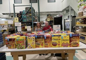 Local food bank volunteers stand behind a recent donation of 500-plus boxes of cereal from École Campbelltown. The Strathcona Food Bank is the winner of this year's Mayor's Award. The Awards of Excellence will be presented on Monday, June 13 at Festival Place. Photo via Twitter/@StrathconaFB