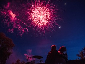 Angela and Kevin enjoy the Victoria Day long weekend fireworks display on Sunday at the Frankford Tourist Park in Quinte West, Ontario. ALEX FILIPE