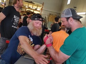 (Left) Donald 'Donny' Burns recently tests his arm wrestling skills and technique against Devon Larratt. Larratt is ranked number one in the super heavy weight class division. He's also in the top 20 world heavy weight class. Burns is in Tweed this weekend to compete in the Ontario Provincial Arm Wrestling Championships.
