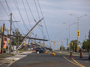 Merivale Road near Viewmount Drive was closed down by the weekend storm with cars trapped under the hydro lines.
