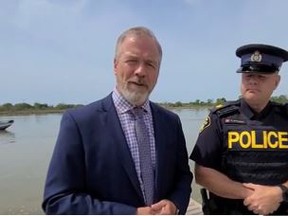 Ontario Provincial Police are appealing to the public for information after the remains of a little girl were found earlier this month in the Grand River in Dunnville. Det. Insp. Shawn Glassford, left, and OPP West Region Acting Sgt. Ed Sanchuk stand near the location where the child’s remains were found. TWITTER