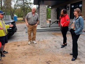 Nestor Priscoe talks about the history of Camp Tillicum to Spencer Merritt, Kendra MacIsaac and Nicole Beattie, in front of the Redpath Youth Centre.
PJ Wilson/The Nugget