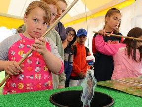 The Upper Thames River Conservation Authority is hosting its first in-person Perth Children's Water Festival at the Falstaff Family Centre in Stratford Sunday. Pictured, kids learn about local aquatic wildlife through a fishing game at a past London Middlesex Children's Water Festival. Submitted photo
