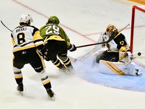 Nic Sima of the North Bay Battalion scores against Marco Costantini of the visiting Hamilton Bulldogs in the second period of their Ontario Hockey League playoff game Wednesday night. Arber Xhekaj can offer no help to his goaltender.
Sean Ryan Photo