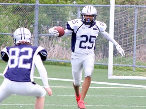 Jaedan Dulaney of the Sudbury Junior Spartans take part in a kick return drill during a practice at James Jerome Sports Complex in Sudbury, Ontario on Thursday, May 26, 2022.