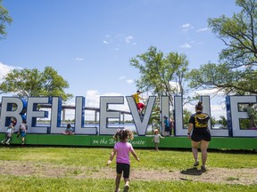 Children climb atop the large Belleville sign on Saturday as they enjoy the Spring Family Funfest held at West Zwick's Island Park in Belleville, Ontario. ALEX FILIPE