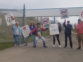 Mock protesters welcomed visitors to the museums new exhibit opening. PHOTO: TANYA BOUDREAU