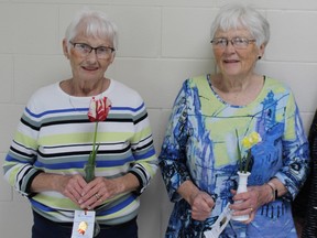 Top winners, L-R: Top points and overall winner Alice Gamble and second place winner Shirley Harris show off a few of their favourite blooms. SUBMITTED