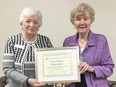 Elaine Metzger(right) is presented with the OHA Honour Roll Award by Anne Harbord (OHA District 2 Director).
