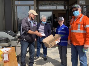 Those participating in the yard sale (as well as anyone else) could stop by the United Church for some barbeque and a break, as well as some shopping! L-R: Rod McDonagh, Elaine Steer, Wyatt Frey and Lloyd Morrison. Hannah MacLeod/Lucknow Sentinel