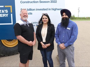 Devon Mayor Jeff Craddock (left) and Coun. Gurk Dhanoa stand alongside provincial Transportation Minister Rajan Sawhney (centre) after a summer road construction announcement on May 27, 2022.