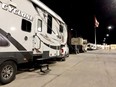 A line of recreational vehicles sits at the south end of a parking lot in this Postmedia file photo.
