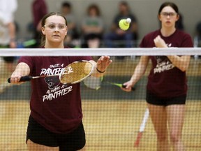 McGregor Panthers' Kaitlyn Sammon, left, serves as partner Jayde McGahan watches during a girls' doubles match at the OFSAA badminton championship at St. Clair College's Chatham Campus HealthPlex in Chatham, Ont., on Friday, May 6, 2022. Mark Malone/Chatham Daily News/Postmedia Network