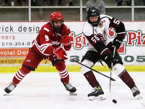 Chatham Maroons' Julien Gervais, right, protects the puck from Leamington Flyers' Anthony Ciaramitaro at Chatham Memorial Arena in Chatham, Ont., on Sunday, May 8, 2022. Mark Malone/Chatham Daily News/Postmedia Network
