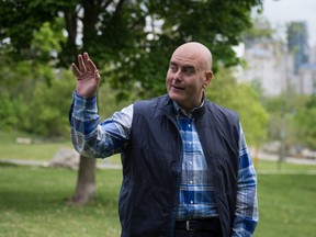 Ontario Liberal Leader Steven Del Duca waves to a supporter before speaking to the media during a campaign stop at Norris Crescent Parkette in Toronto, Saturday, May 28, 2022.