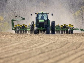 Jordan Fleming, a Delaware area farmer starts to get his corn in on a rented field east of Komoka. (Mike Hensen/The London Free Press)