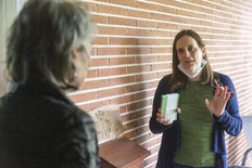 Carol Dyck, campaigning door to door for the Green Party in London North Centre on Tuesday May 17, 2022, talks to homeowner Janet Smolders. The Greens have a comprehensive platform, a Western University political scientist says. (Mike Hensen/The London Free Press)