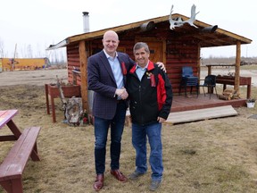 Peter Hansen, president of McMurray Métis, poses with Don Scott after announcing the former mayor is the organization's executive director on May 10, 2022. Image courtesy Melanie Walsh/McMurray Métis