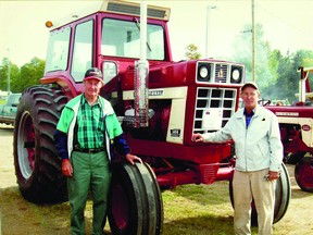 Don and Cliff Schultz with International 1486 Farmall tractor