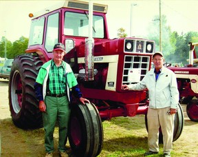 Don and Cliff Schultz with International 1486 Farmall tractor