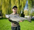 Top youth James Thompson, of Mallory Beach, with his 10.20 lb. salmon caught in the Lures N Lines Spring Trout Derby Sunday, May 15, 2022. (Kevin Harders photo)