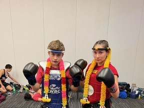Logan Sanderson and Ocean Cofre, two champions of the Muay Thai Canadian Youth Games, stand triumphantly after their bouts on April 16. Seven Bellagarde's Dragons will be competing at the Muay Thai World Youth Games come August. Photo courtesy of Luis Cofre/ Bellagarde's Dragons.