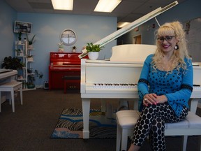 Lisa Ammirati sits in one of the practice rooms of Skyline Music Studio, among some of the pianos which students are taught on at the school. The business is celebrating it's sixth year since opening it's doors in Airdrie.