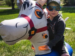A young boy rised atop his inflatable steed during a past Airdrie Children's Festival. The Festival is making a full return this year, with plenty of entertainment and educational opportunities at Nose Creek Park on May 28 and 29.