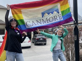 Canmore High School students raise a flag at the Town of Canmore on International Day Against Homophobia, Transphobia and Biphobia on May 17, 2022. (Pictured) Sierra Bramble (Toby) and Myla Corey. Photo Marie Conboy/ Postmedia.